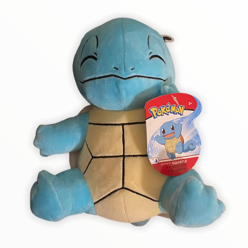 Squirtle plushie sitting with other Pokemon collectibles